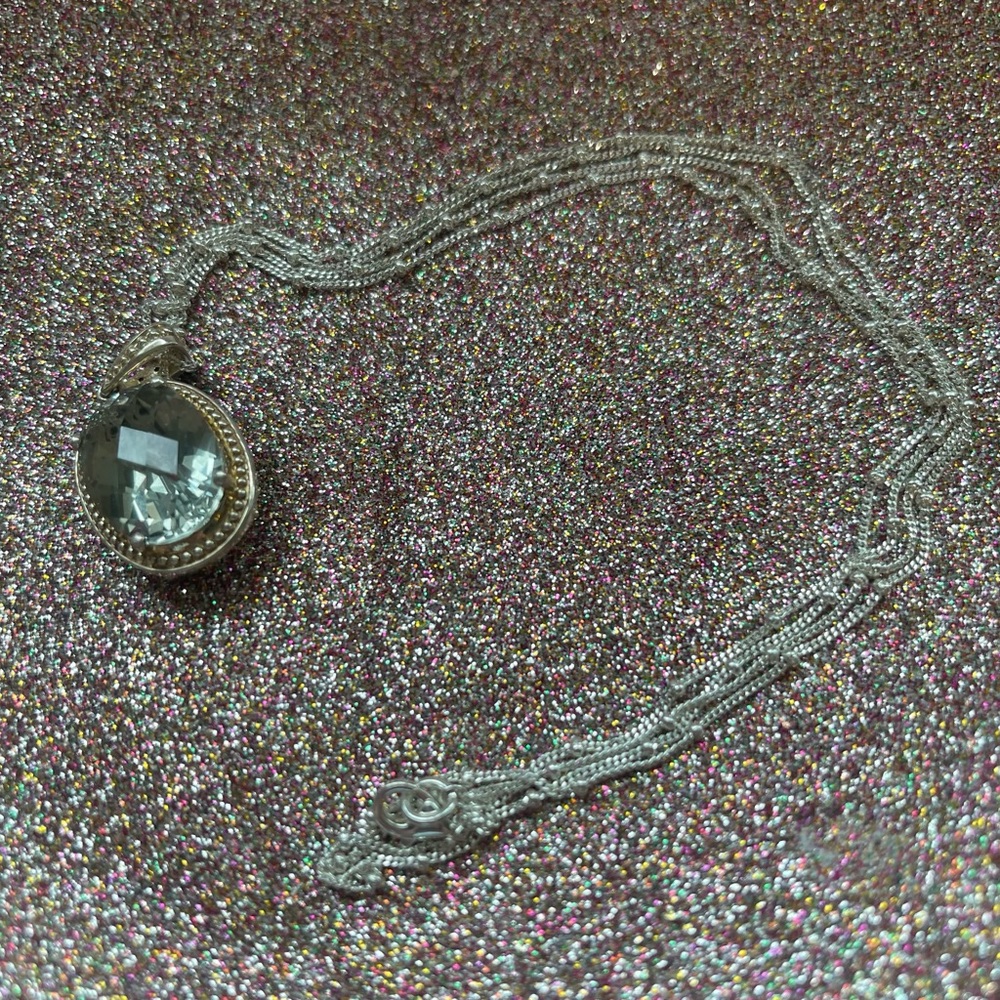 Sterling silver necklace with a very light green stone.